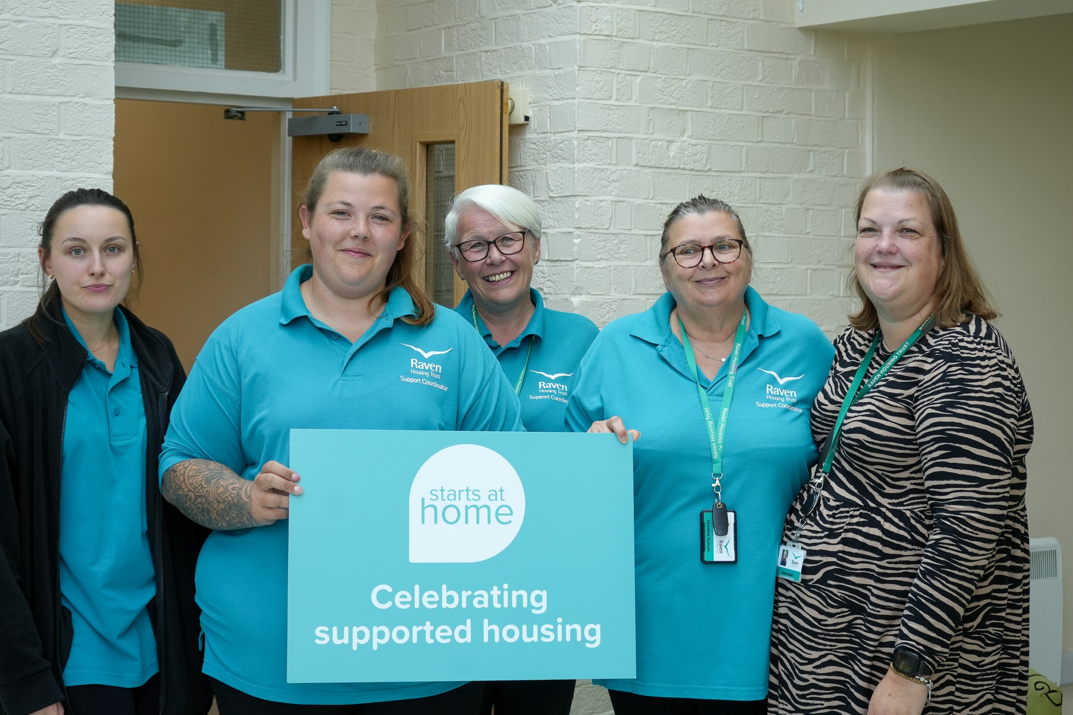 Raven support co-ordinators with Starts at Home sign