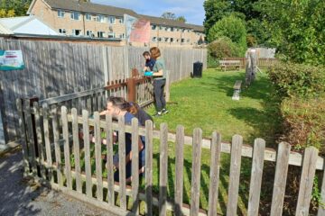 Raven team painting fences